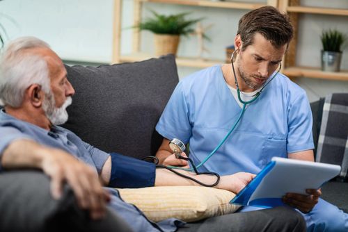 A VSH doctor consulting a patient at home